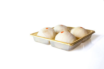 High angle view of chocolate cake against white background