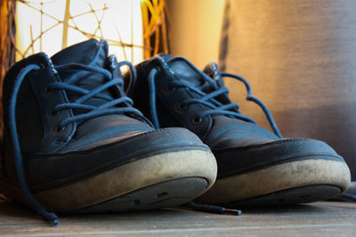 Close-up of shoes on wall