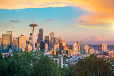 Cityscape against sky during sunset