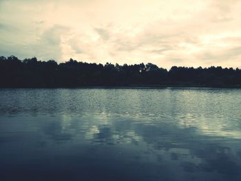 Scenic view of lake at sunset