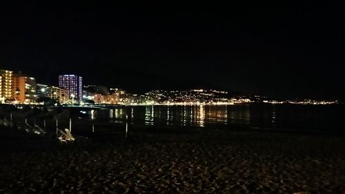 Illuminated cityscape at night