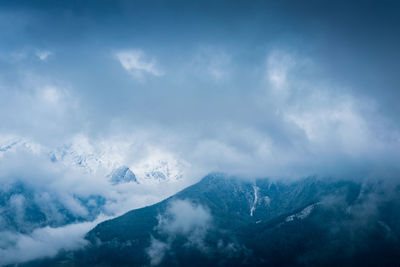 Low angle view of mountain range against sky