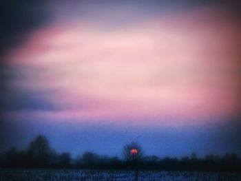 Scenic view of landscape against sky at sunset