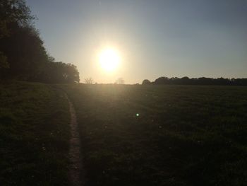 Scenic view of field against sky during sunset