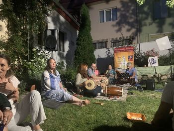 People sitting in front of building