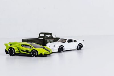 Toy car against white background