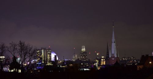 Low angle view of skyscrapers lit up at night