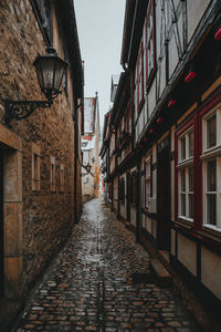 Narrow alley amidst buildings in city