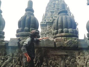 Rear view of a statue against temple