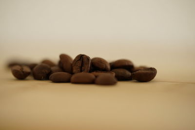 Close-up of coffee beans on table