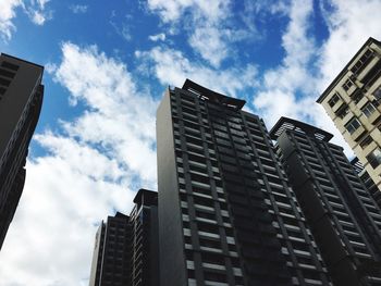 Low angle view of skyscrapers against sky