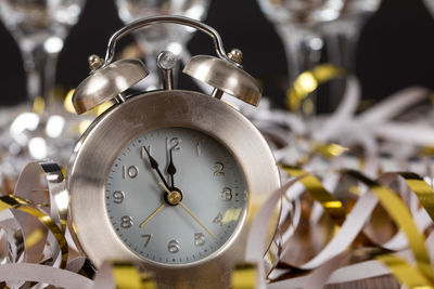 Close-up of alarm clock on ribbons