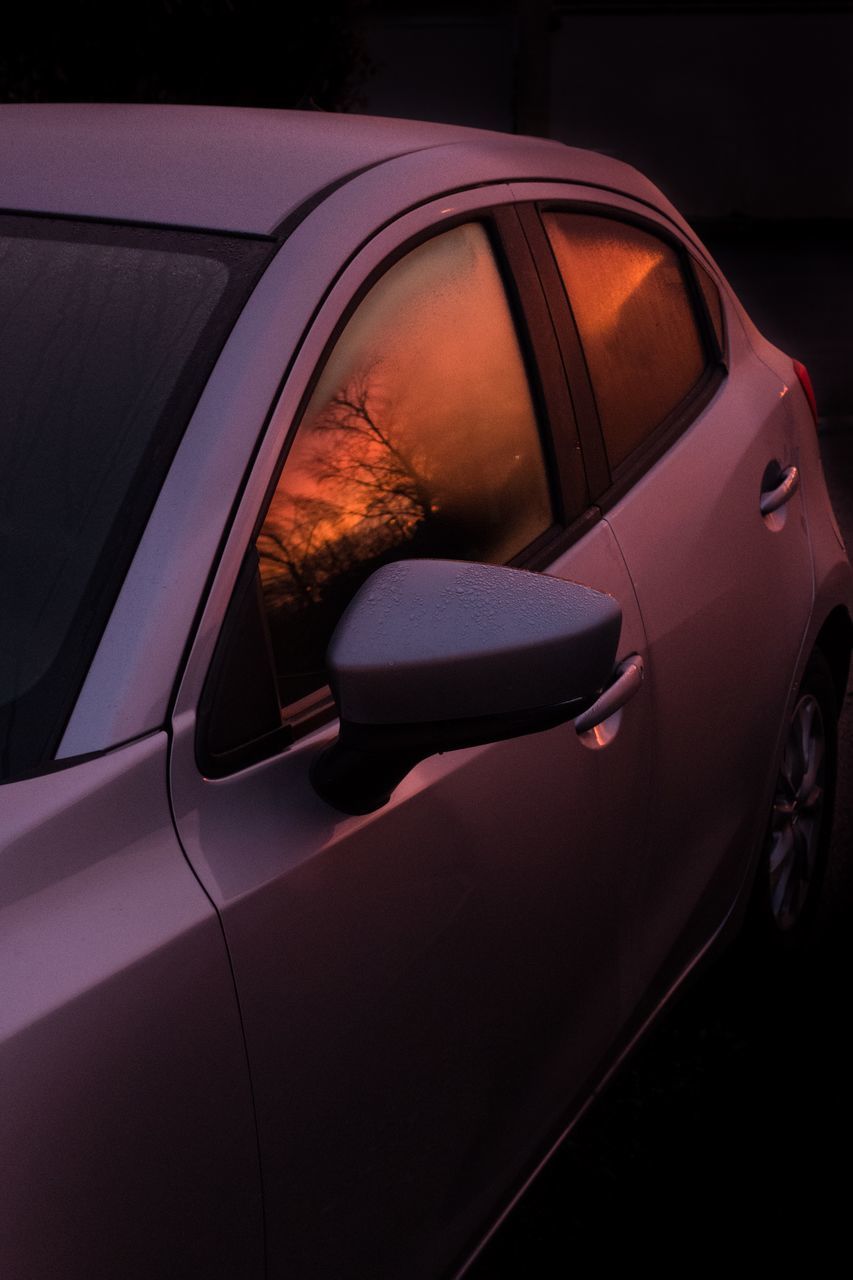 motor vehicle, car, mode of transportation, transportation, land vehicle, no people, reflection, stationary, red, outdoors, close-up, glass - material, day, nature, orange color, street, car door, window