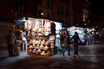 People at street market in city at night