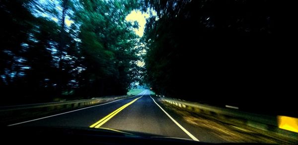 Road seen through car windshield