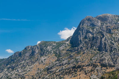 Low angle view of rock formations against sky