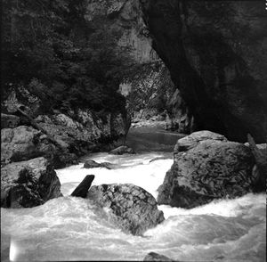 Scenic view of river amidst mountains