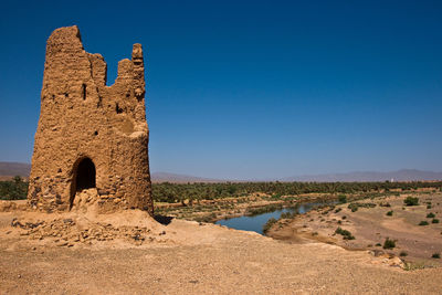 Old ruins against clear blue sky