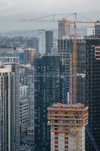 Modern buildings against sky in city