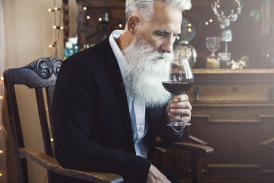 Portrait of man holding wineglass