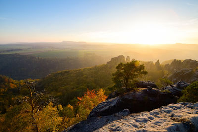 Scenic view of mountains against sky at sunset