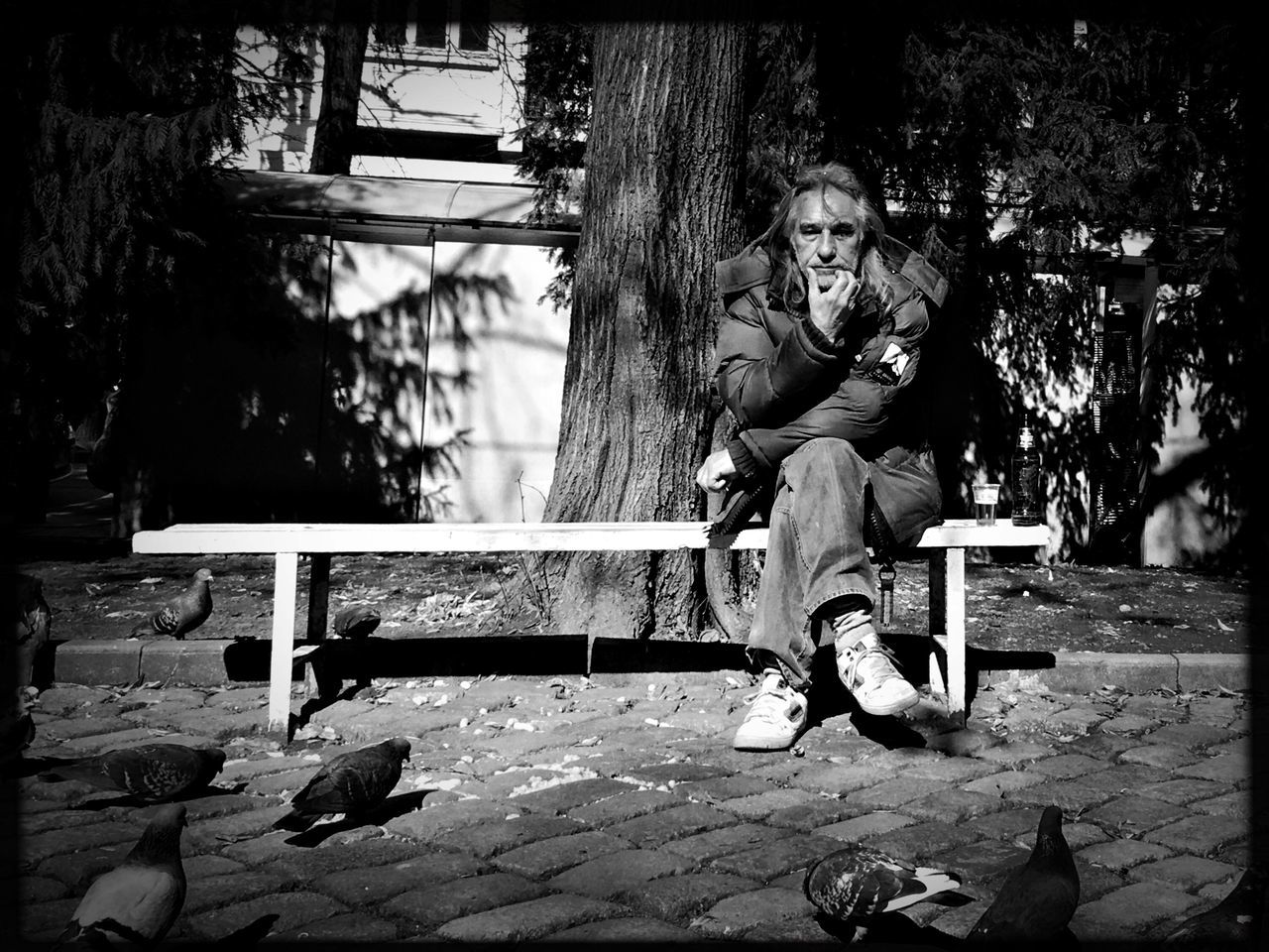 sitting, real people, bench, full length, outdoors, one person, leisure activity, lifestyles, senior adult, artist, day, tree, men, adult, young adult, nature, people, adults only