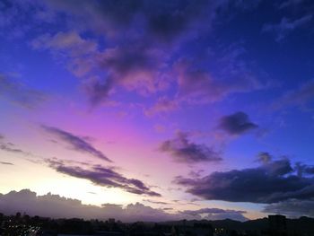 Low angle view of silhouette trees against sky during sunset