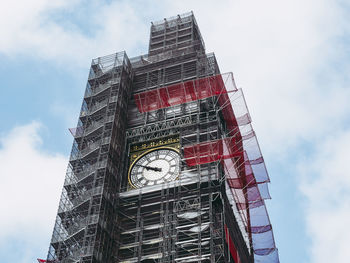 Low angle view of clock tower against sky