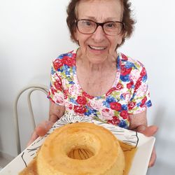 Portrait of senior woman carrying food in plate