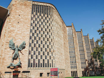 Low angle view of building against blue sky