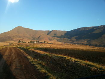 Road passing through field