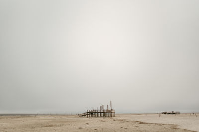 Scenic view of beach against clear sky