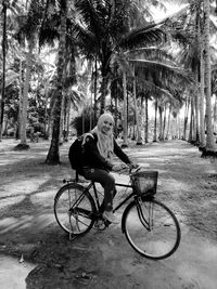 Man riding bicycle on road