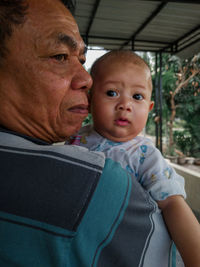 Close-up of man with grandson