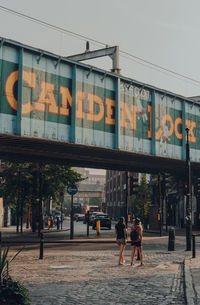 People walking on street in city