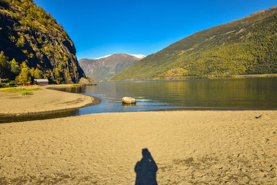 Scenic view of lake against mountain range