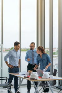 People working on table in office