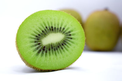 Close-up of fruit against white background