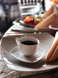 Close-up of coffee cup on table