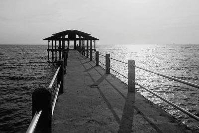 Pier on sea against sky