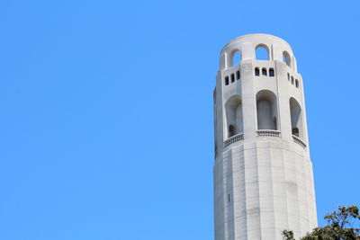 Low angle view of tower against clear blue sky