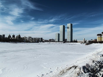 View of cityscape with sea in background