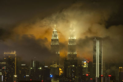 Illuminated buildings in city at night