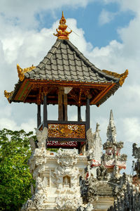 Low angle view of temple against building