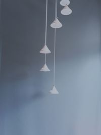 Lighting equipment hanging against wall in room