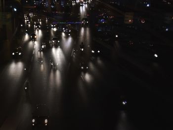 People on road in city at night