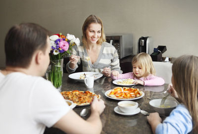 People having food on table