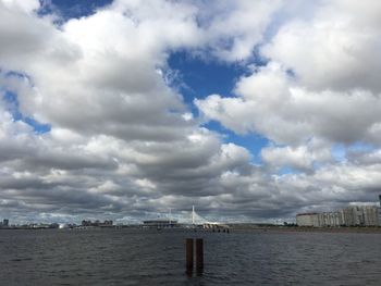 Scenic view of sea and buildings against sky