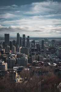 High angle view of buildings in city against sky