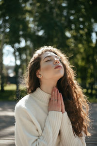 Portrait of young woman looking away